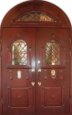 Стальная арочная дверь со стеклом и ковкой ДА-30 в дом из кирпича в Волжском