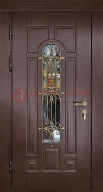 Темная железная дверь со стеклом и ковкой для частного дома ДСК-156 в Волжском