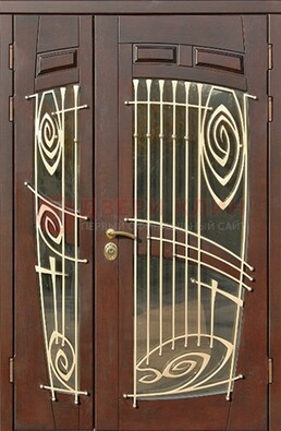 Коричневая железная дверь с большим стеклом и ковкой ДСК-203 в Волжском